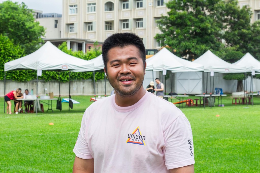 A Unison member smiles at the camera.